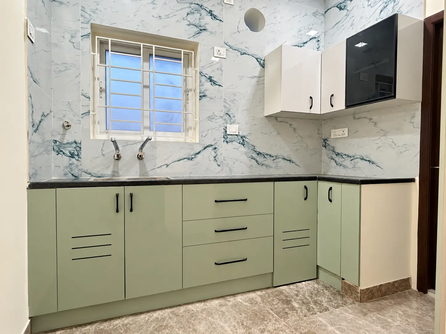Semi-modular kitchen designed for a completed 2 BHK apartment in Pozhichalur